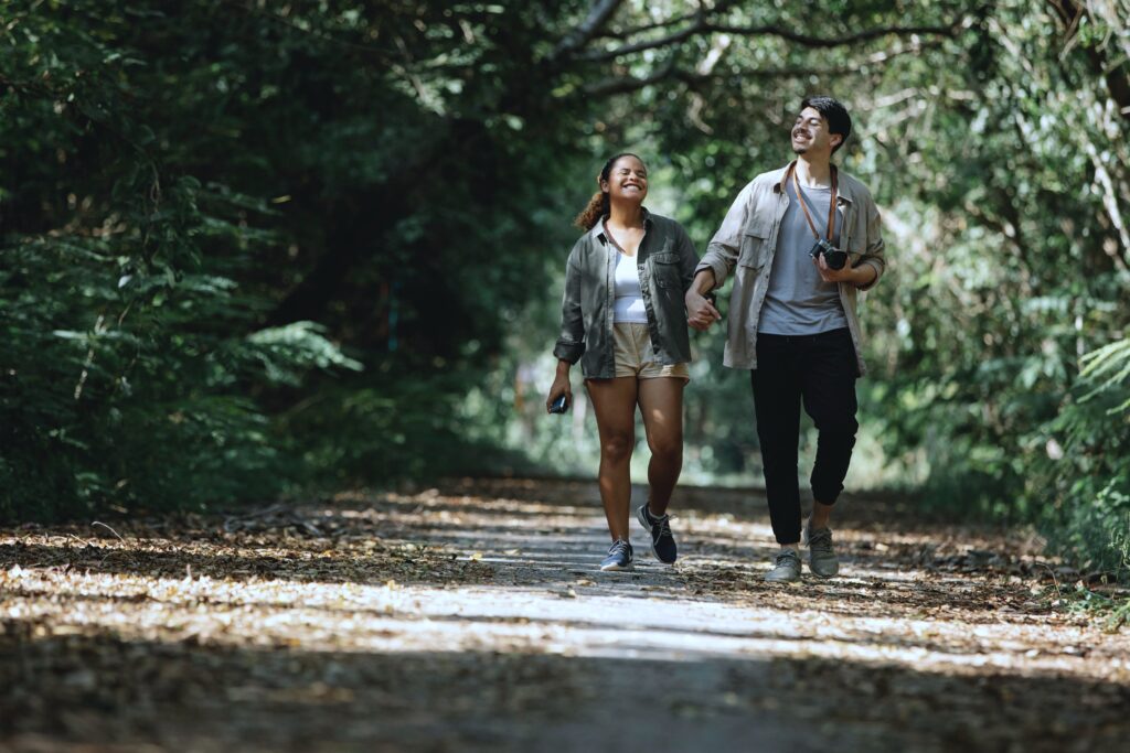 Two people walking in a park 1 - Rendé - conversation starters and date ideas