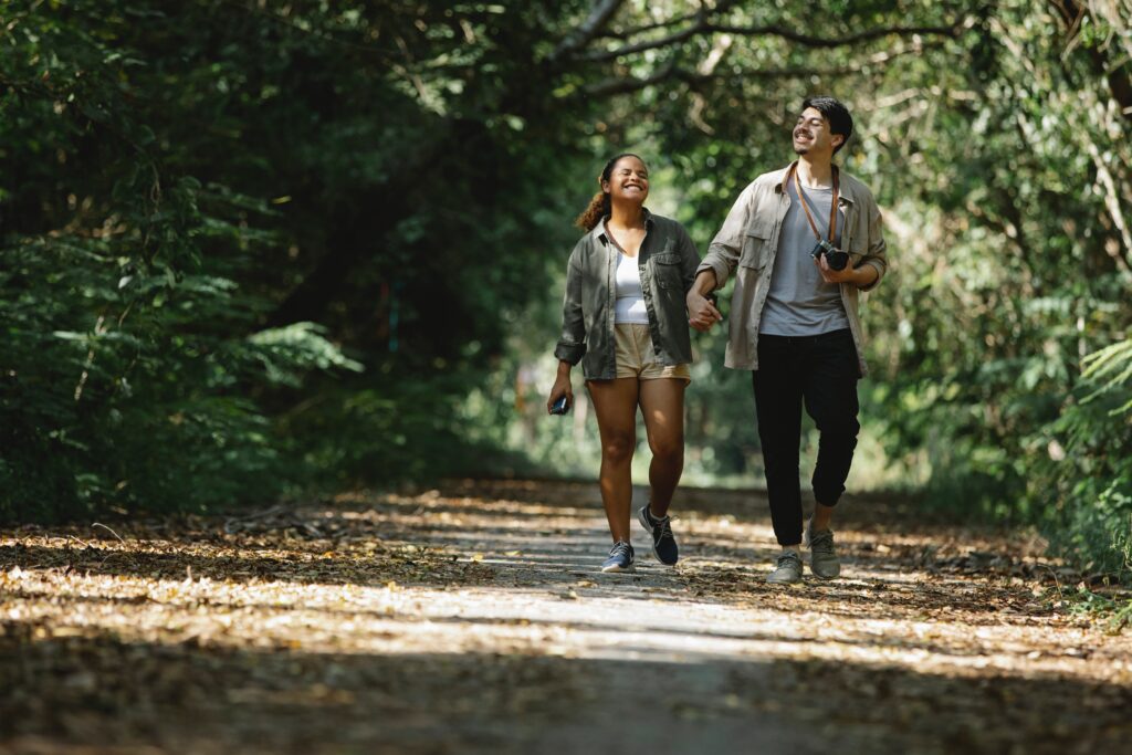 Two people walking in a park 2 - Rendé - conversation starters and date ideas