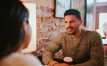 A man and a woman sharing a coffee on a date - Rendé - conversation starters and date ideas