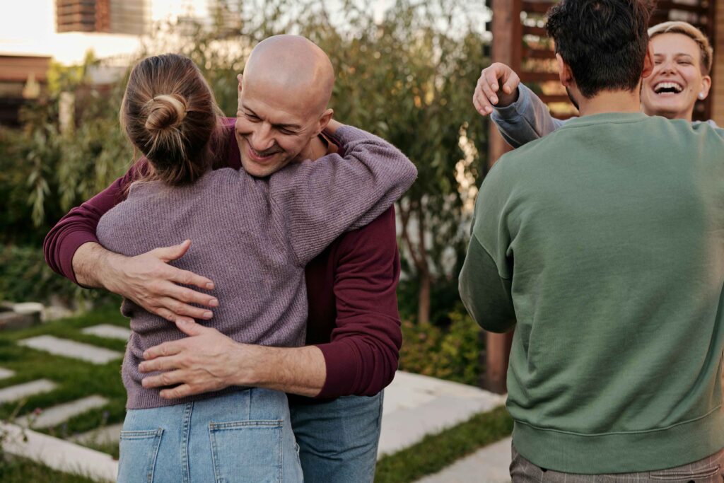 People hugging each other as a greeting