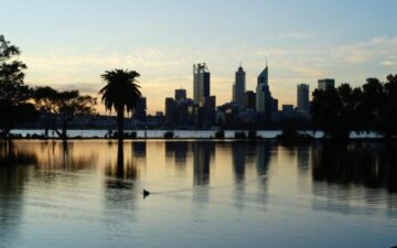 Sunset photo of water with Perth Australia city skyline in the background